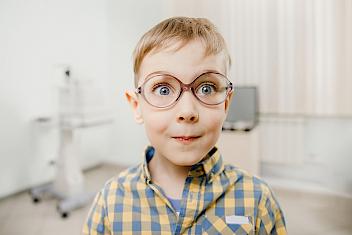 Kid with glasses at an eye clinic